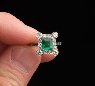 Lot 372 - Emerald and Diamond Ring. An art deco emerald and diamond cluster ring