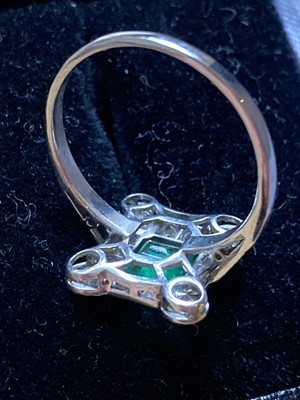 Lot 372 - Emerald and Diamond Ring. An art deco emerald and diamond cluster ring
