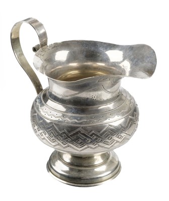 Lot 427 - Russian Silver. A 19th-century Russian silver cream jug by AK, Moscow 1880