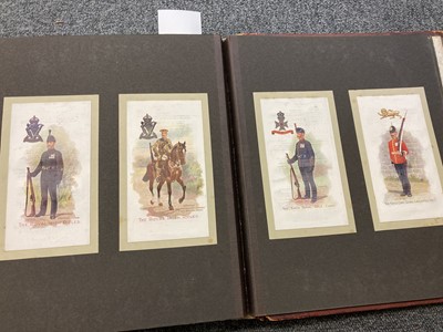 Lot 265 - Regimental Postcards. An album of regimental picture postcards, George Falkner & Sons circa 1910