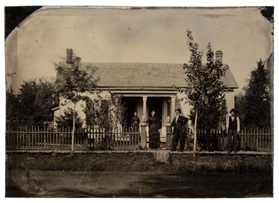 Lot 171 - Tintypes. A three-quarter plate tintype of a group of 4 people by their picket fence
