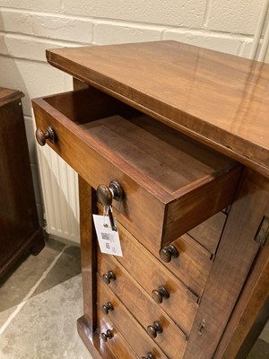 Lot 122 - Wellington Chest. A Victorian walnut wellington chest