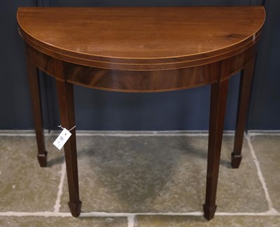 Lot 98 - Tea Table. An early 19th century mahogany demi-lune foldover tea table