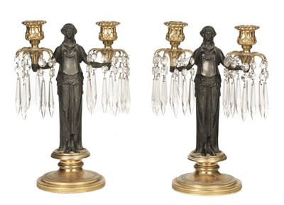 Lot 17 - Candle Stands. A pair of late 19th century French patinated and ormolu candle stands