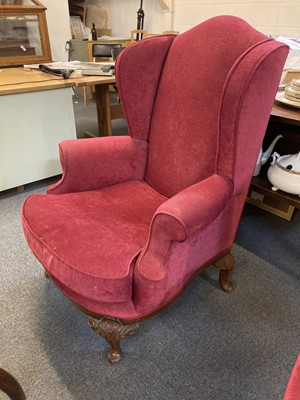 Lot 105 - Armchair. An early 20th century wing-back armchair