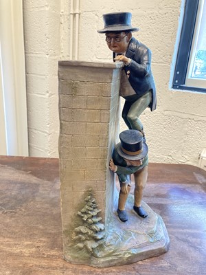 Lot 75 - Mr Pickwick. A large pottery vase modelled as Mr Pickwick climbing a wall