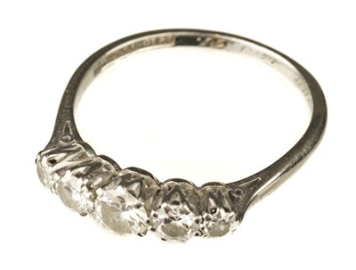 Lot 56 - Ring. An 18ct gold and platinum five stone diamond ring