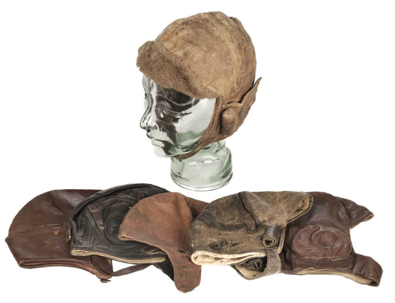 Lot 213 - Flying Helmets. A collection of WWI and interwar period leather flying helmets