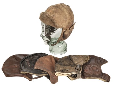 Lot 213 - Flying Helmets. A collection of WWI and interwar period leather flying helmets