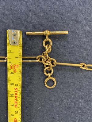 Lot 71 - Watch Chain. An Edwardian 18ct gold trombone link watch chain, 57.8g