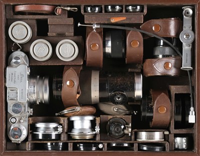 Lot 145 - Leica IIIf film camera with several lenses and accessories