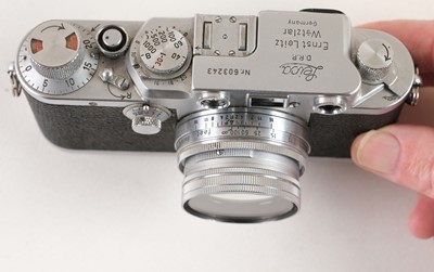 Lot 145 - Leica IIIf film camera with several lenses and accessories
