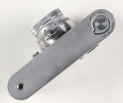 Lot 145 - Leica IIIf film camera with several lenses and accessories