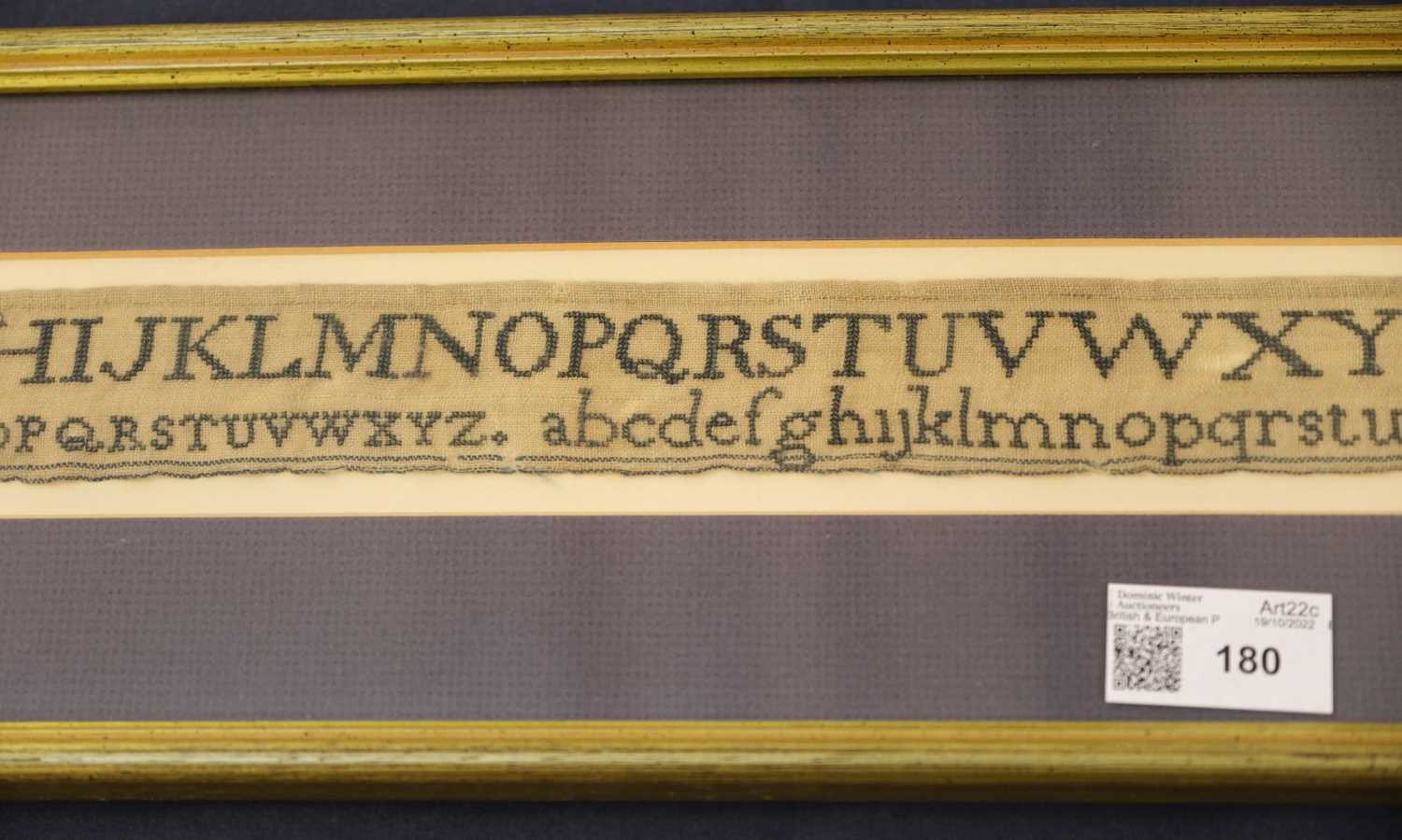 Lot 180 Sampler. An unusual alphabet needlework, by