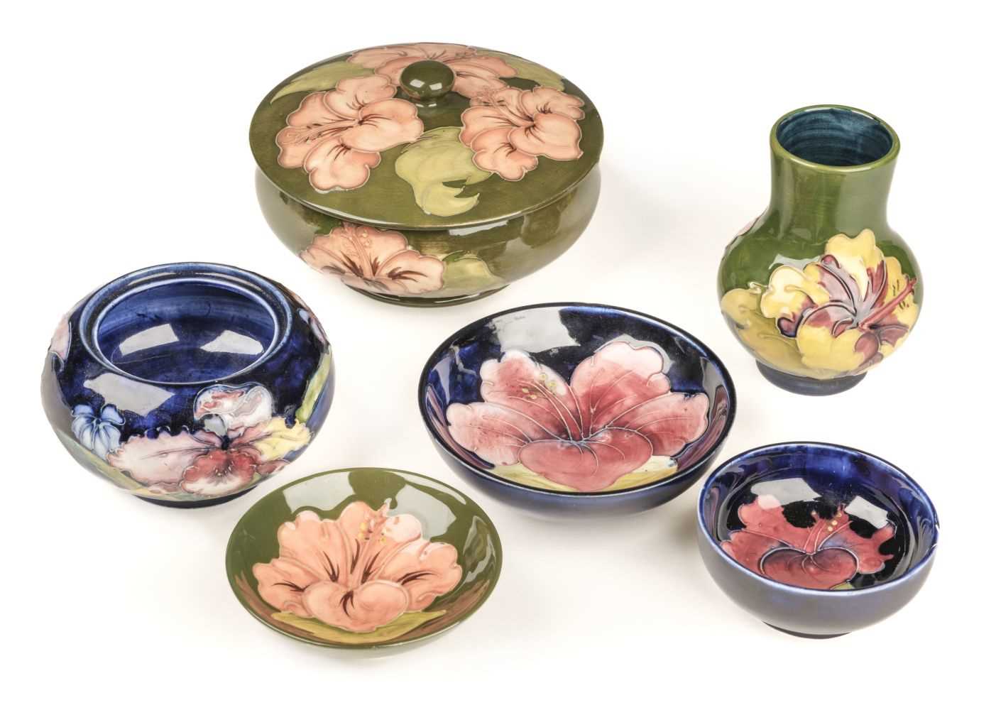 Lot 10 - Moorcroft. A Moorcroft pottery Hibiscus pattern lidded bowl and other items