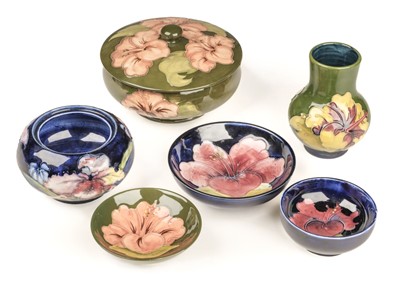 Lot 10 - Moorcroft. A Moorcroft pottery Hibiscus pattern lidded bowl and other items