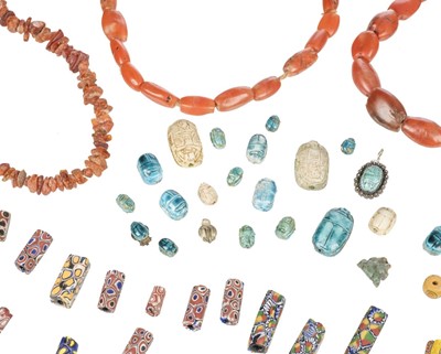 Lot 120 - Egypt. A collection of 20 faience scarabs and glass beads