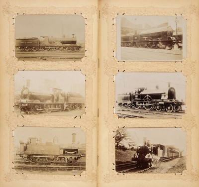 Lot 269 - Railway Postcards. An album containing approximately 330 sepia real photo postcards by E. Pouteau