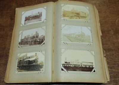 Lot 270 - Railway Postcards. An album containing approximately 450 real photo postcards of railway interest