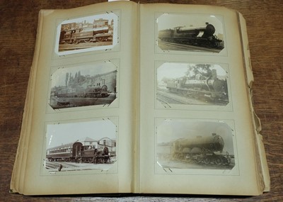 Lot 270 - Railway Postcards. An album containing approximately 450 real photo postcards of railway interest