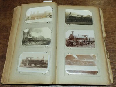 Lot 270 - Railway Postcards. An album containing approximately 450 real photo postcards of railway interest