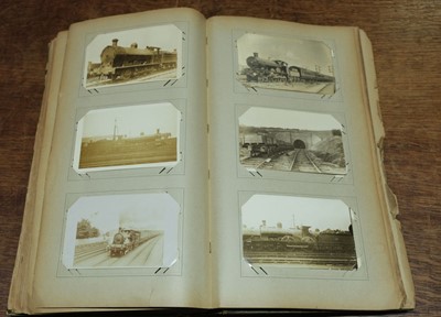 Lot 270 - Railway Postcards. An album containing approximately 450 real photo postcards of railway interest