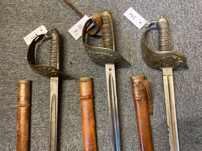 Lot 396 - Swords. A WWI period 1897 levee pattern sword by Samuel Brothers Ltd and two others