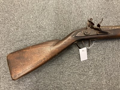 Lot 329 - Gun. A 19th-century flintlock musket, probably an Indian-made piece