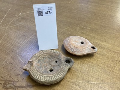 Lot 437 - Oil Lamp. A Roman terracotta oil lamp, circa 1st century A.D.