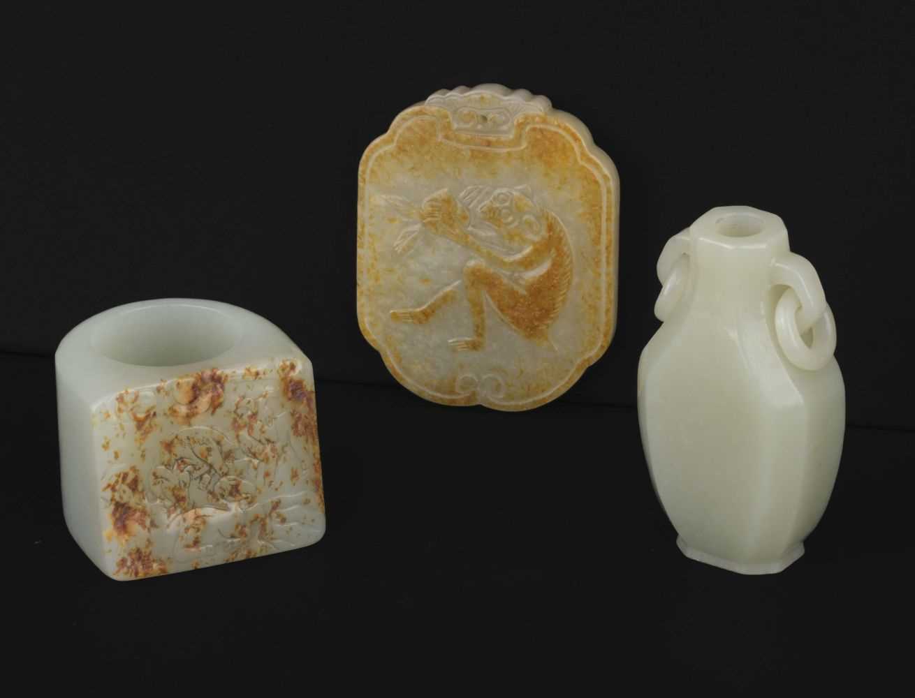 Lot 444 - Jade. A Chinese miniature jade vase, archers ring and pei