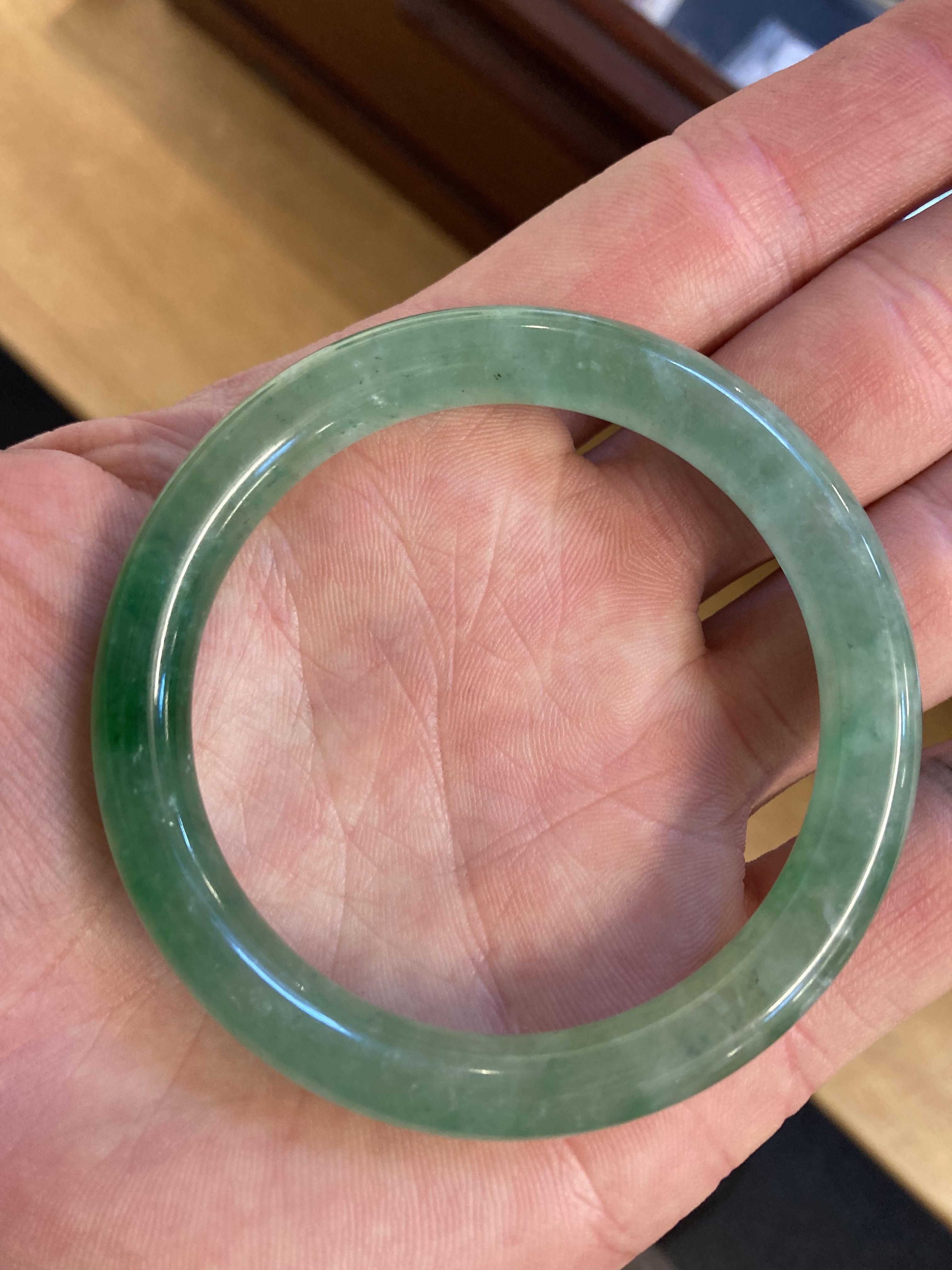Lot 447 Jade. Two Chinese jade bangles