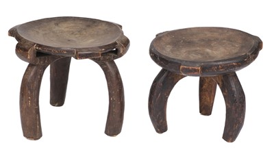 Lot 463 - Tribal Art.  A pair of early 20th century African hardwood stools