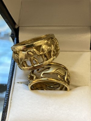 Lot 485 - Rings. A modern 14ct gold ring pierced with wild animals including rhinoceros, size P, 10g