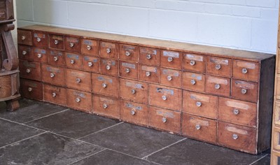 Lot 196 - Shop Fitting. A late Victorian bank of 40 drawers