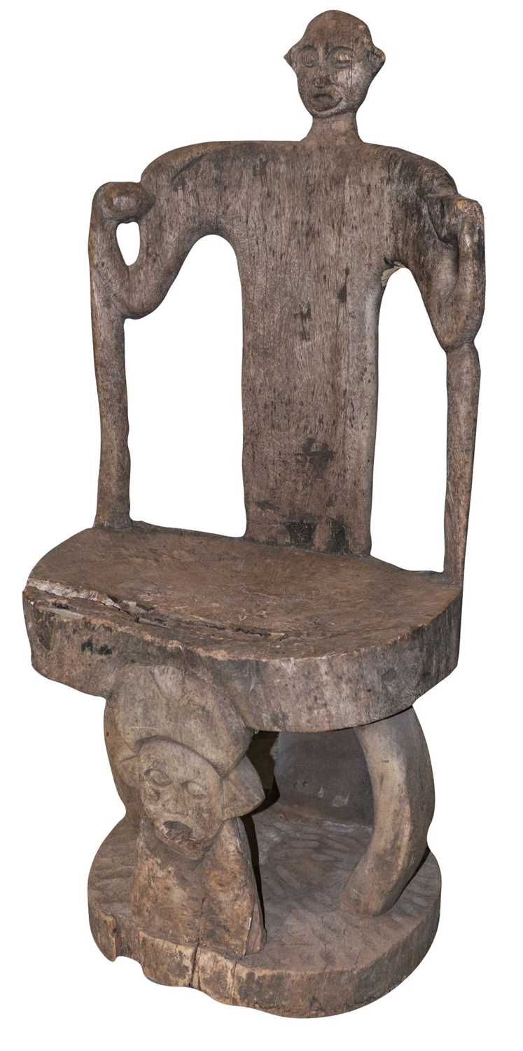 Lot 469 - Tribal Art. An early to mid 20th century African hardwood chair