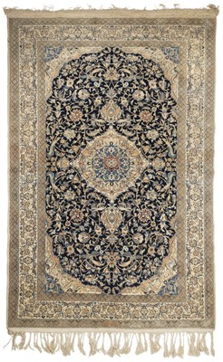 Lot 593 - Carpet. An early 20th century Persian silk carpet