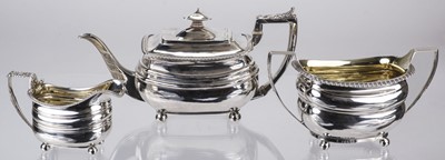 Lot 498 - Tea Service. A matched George III silver three-piece tea set
