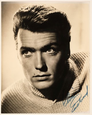 Lot 217 - Eastwood (Clint, 1930-). A vintage signed glossy photograph of the young actor