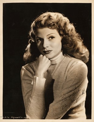 Lot 229 - Hayworth (Rita, 1918-1987). A vintage signed and inscribed glossy photograph