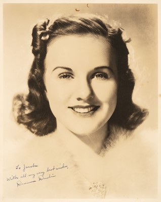 Lot 216 - Durbin (Deanna, 1921-2013). A vintage signed and inscribed sepia photograph