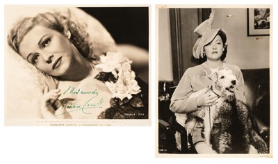 Lot 243 - Loy (Myrna, 1905-1993). A signed glossy film still of the actress with a fox terrier