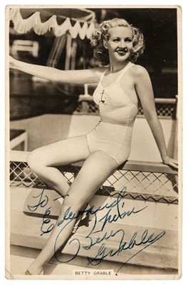 Lot 226 - Grable (Betty, 1916-1973). A vintage real photo publicity postcard