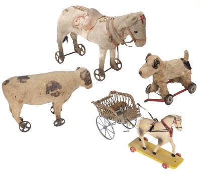 Lot 515 - Toy Animals on Wheels. Donkey pull along, circa 1904.