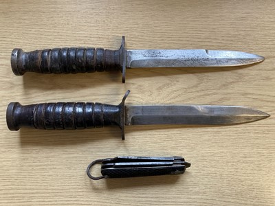 Lot 74 - Fighting Knife. An American M-3 Utica fighting knife and two other knives