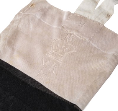 Lot 287 - Victoria (Queen, 1819-1901). A pair of Queen Victoria's black and cream silk stockings