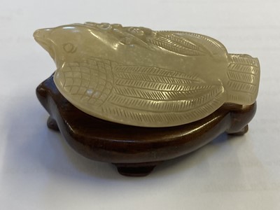 Lot 485 - Jade. A Chinese jade pebble, carved as a bird plus a chilong