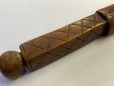 Lot 457 - Treen. A 17th century treen apple corer dated 1696