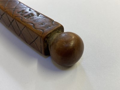 Lot 457 - Treen. A 17th century treen apple corer dated 1696