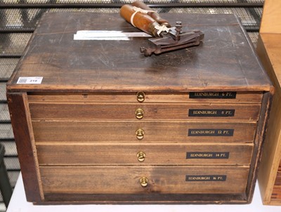 Lot 218 - Type and type cabinet. Five sets of brass type