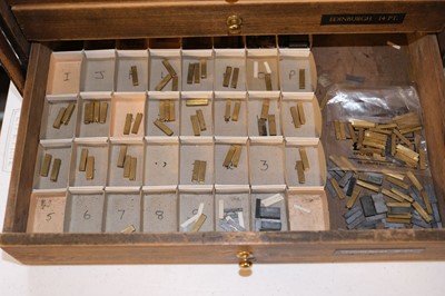 Lot 218 - Type and type cabinet. Five sets of brass type